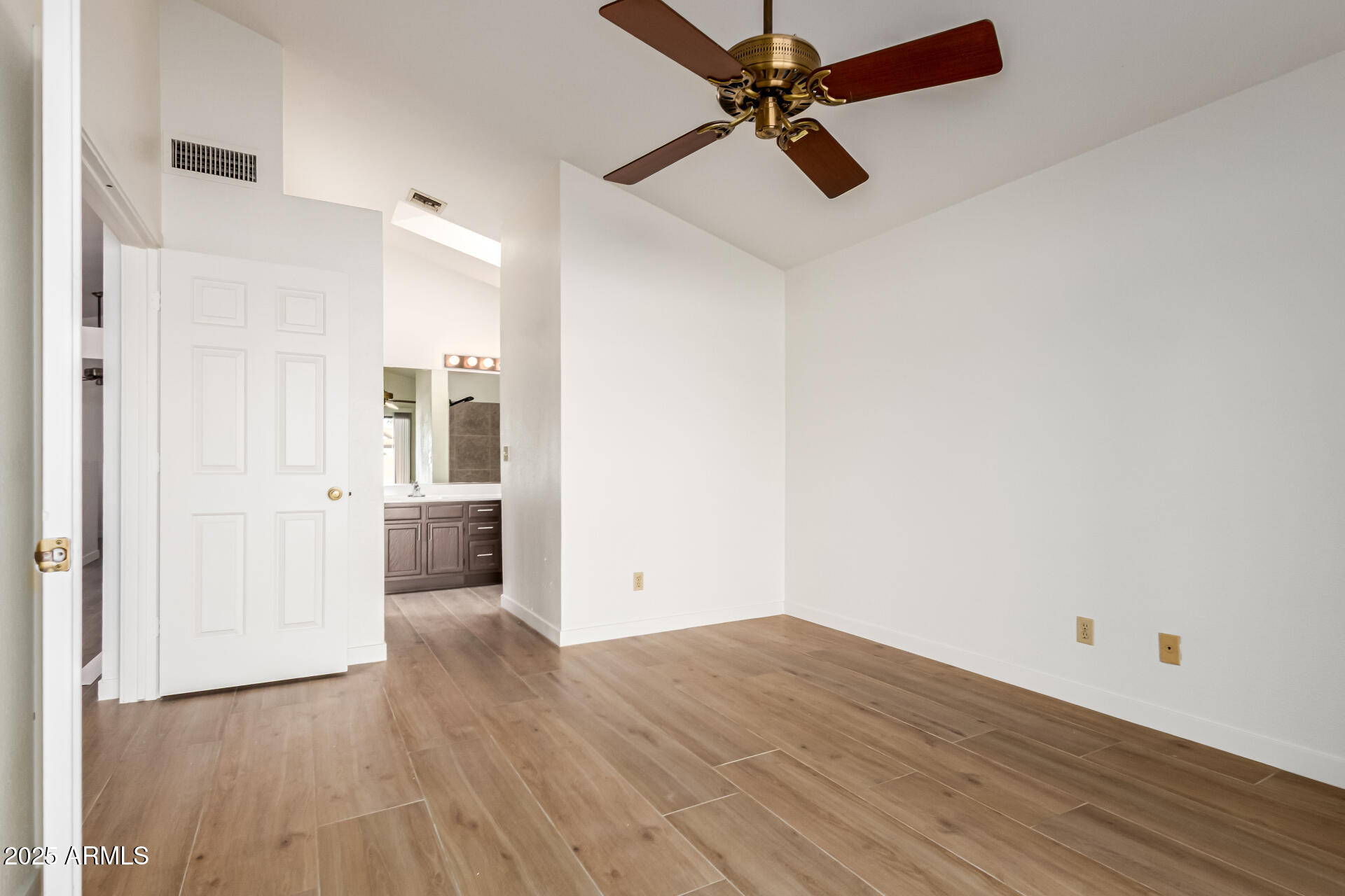 768 South Martinique Drive Gilbert, AZ 85233 - Photo 16 of 27 a view of a room with wooden floor and white walls