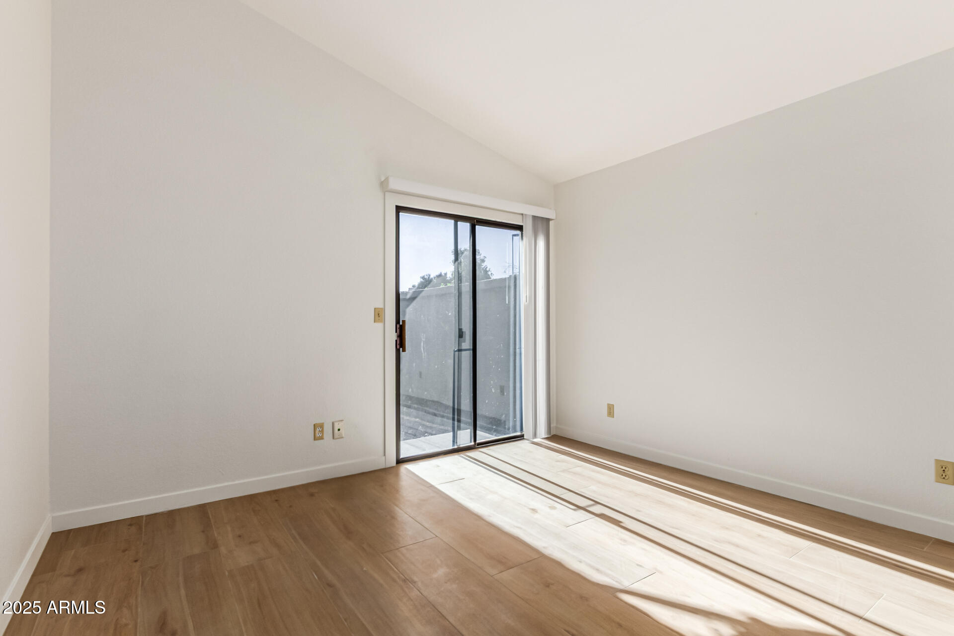 768 South Martinique Drive Gilbert, AZ 85233 - Photo 18 of 27 an empty room with wooden floor and windows