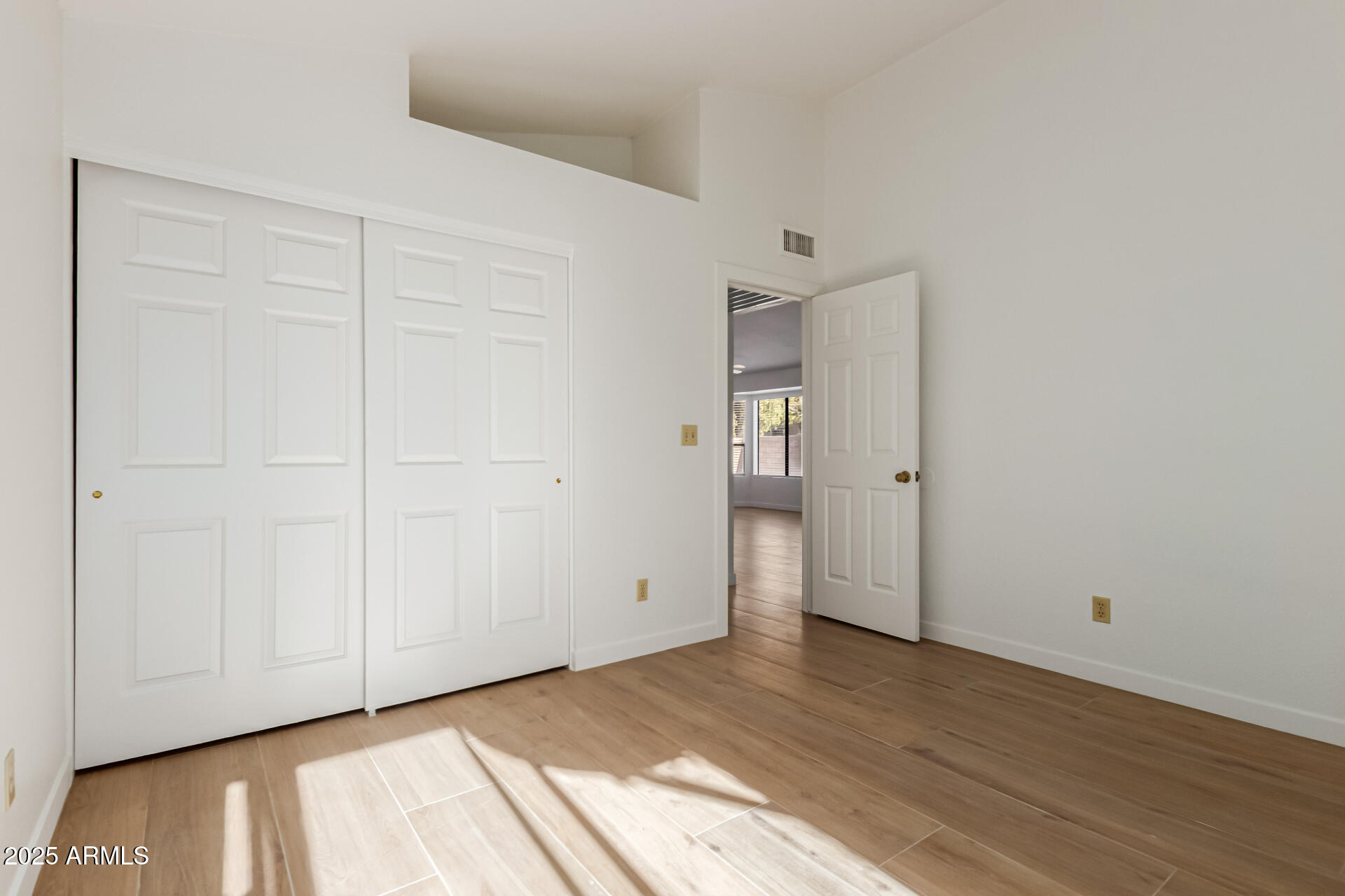 768 South Martinique Drive Gilbert, AZ 85233 - Photo 19 of 27 an empty room with wooden floor