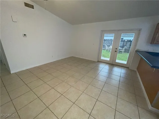 a view of an empty room and window