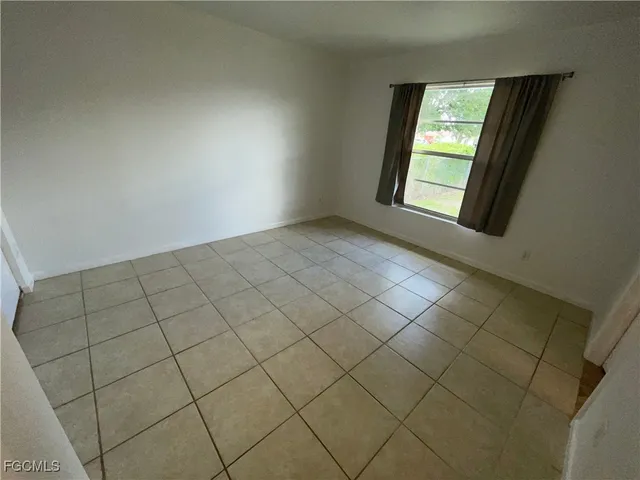 a view of an empty room and window