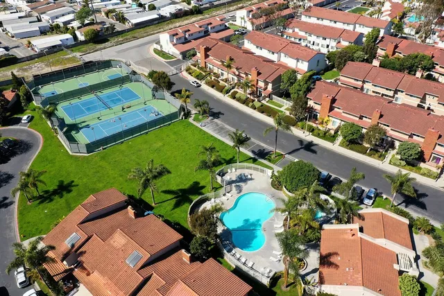 an aerial view of a house with a swimming pool yard and outdoor seating
