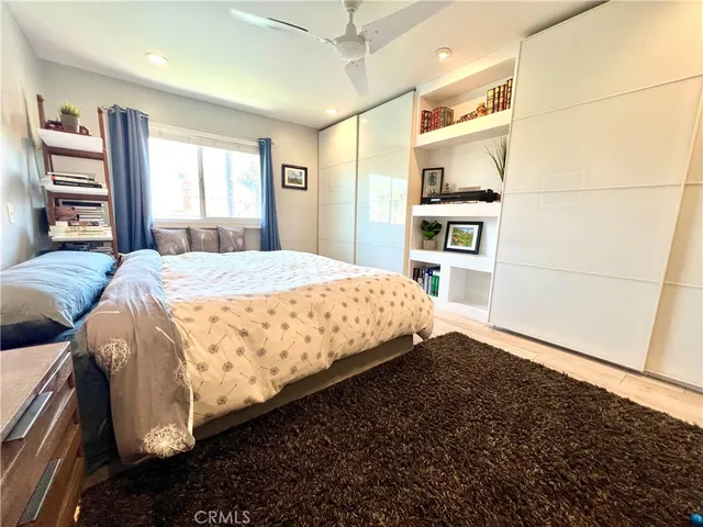 a bedroom with a large bed and a window