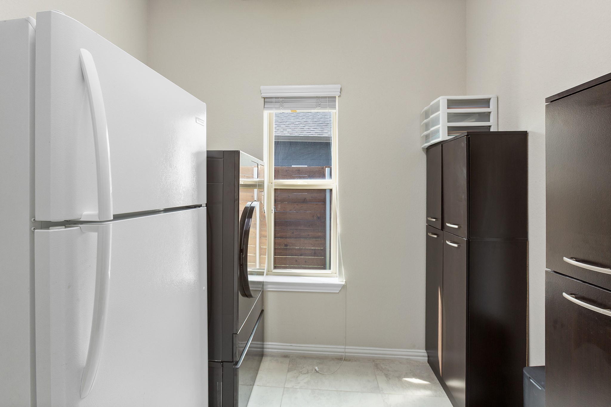 8709 Slater Drive Austin, TX 78747 - Photo 22 of 36 a view of kitchen with a refrigerator cabinets and a refrigerator
