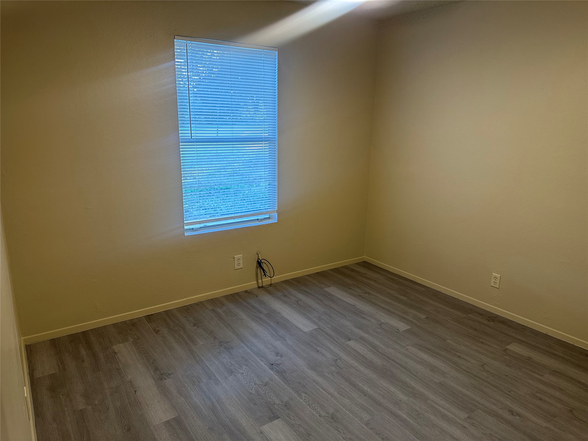 2602 South Bagdad Road, Unit A Leander, TX 78641 - Photo 15 of 26 Newly installed wood-look flooring sets a clean, contemporary foundation in this inviting room.