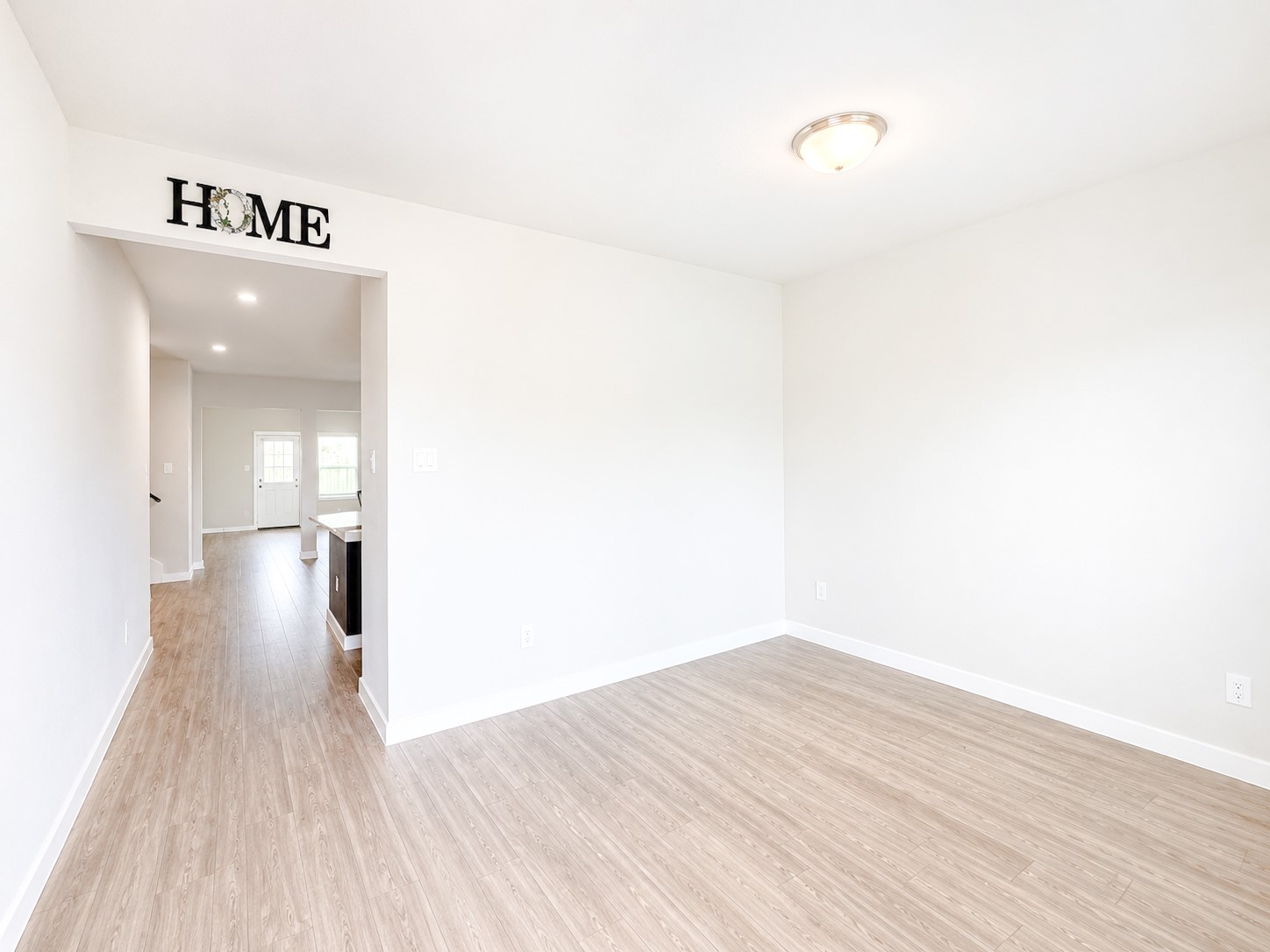 323 Bennett Street Angleton, TX 77515 - Photo 2 of 21 a view of a hallway with wooden floor