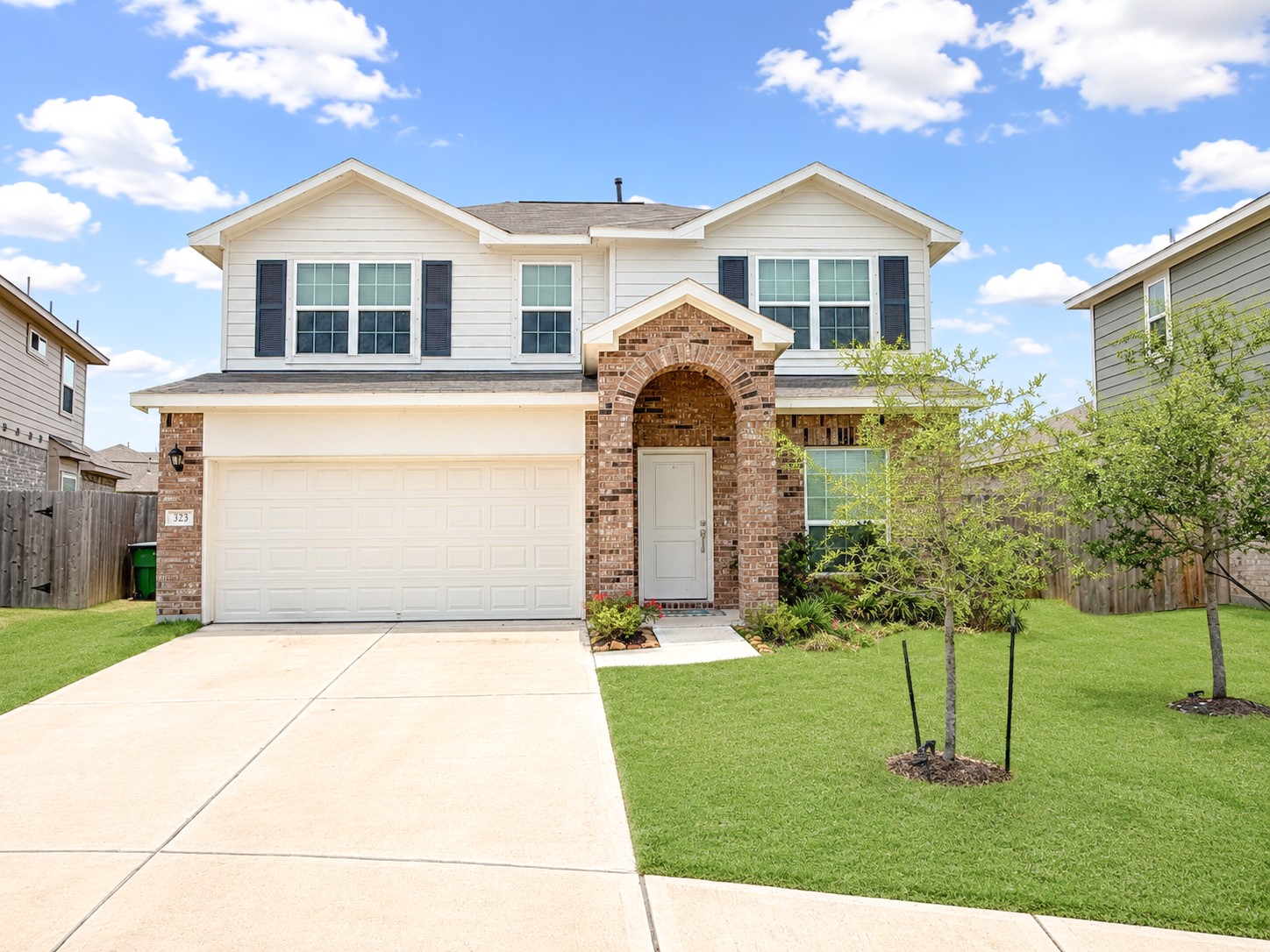 323 Bennett Street Angleton, TX 77515 - Photo 21 of 21 a front view of a house with a yard and trees