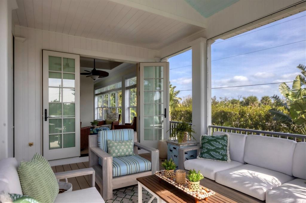 2425 24th Street West Boca Grande, FL 33921 - Photo 15 of 53 a living room with furniture and a floor to ceiling window
