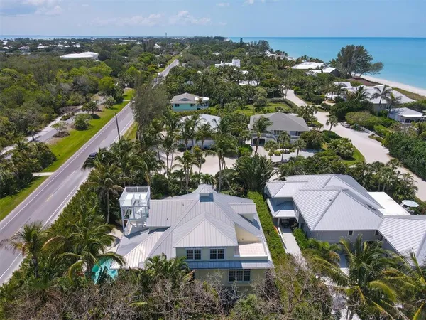 an aerial view of house with yard