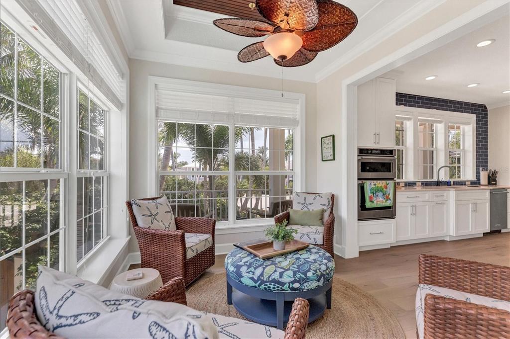 2425 24th Street West Boca Grande, FL 33921 - Photo 21 of 53 a living room with furniture and a floor to ceiling window