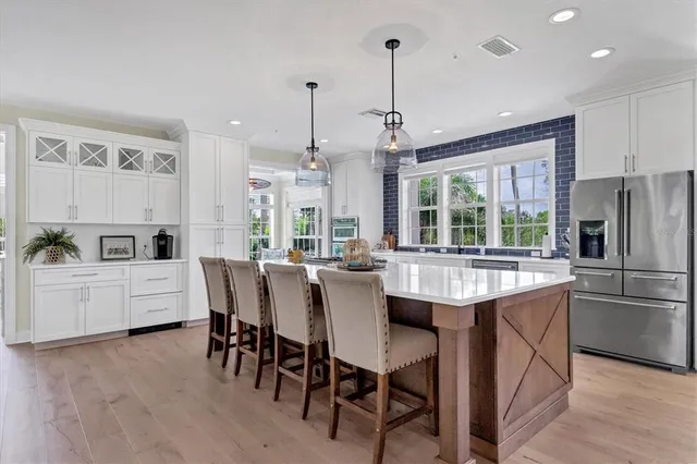 a kitchen with sink stove and cabinets