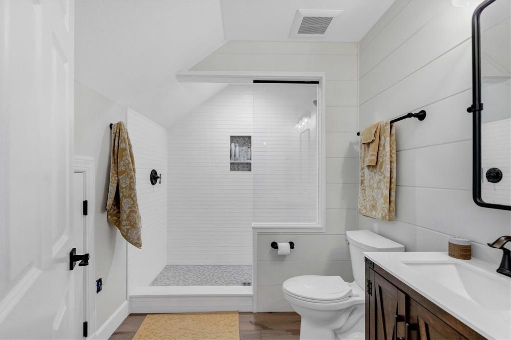 2425 24th Street West Boca Grande, FL 33921 - Photo 37 of 53 a bathroom with a granite countertop sink toilet and shower
