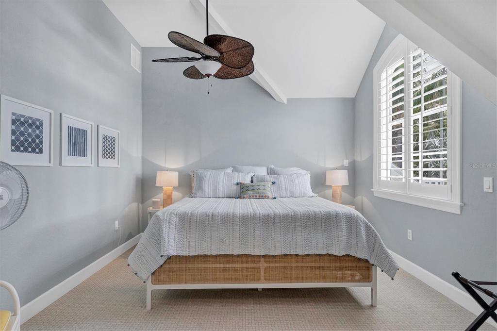 2425 24th Street West Boca Grande, FL 33921 - Photo 39 of 53 a bedroom with a bed and window