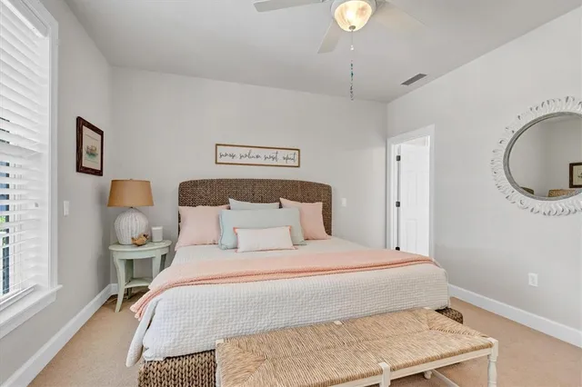 a bed room with a bed and a chandelier