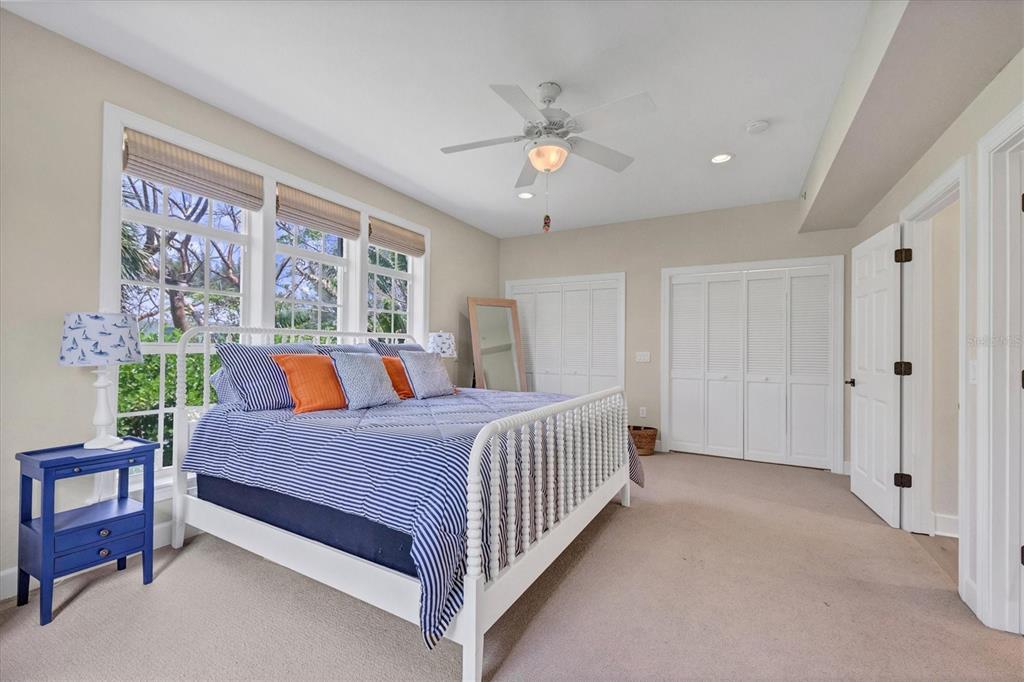2425 24th Street West Boca Grande, FL 33921 - Photo 44 of 53 a bed room with a bed and a chandelier