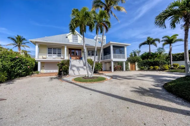 a front view of a house with a yard and a garage