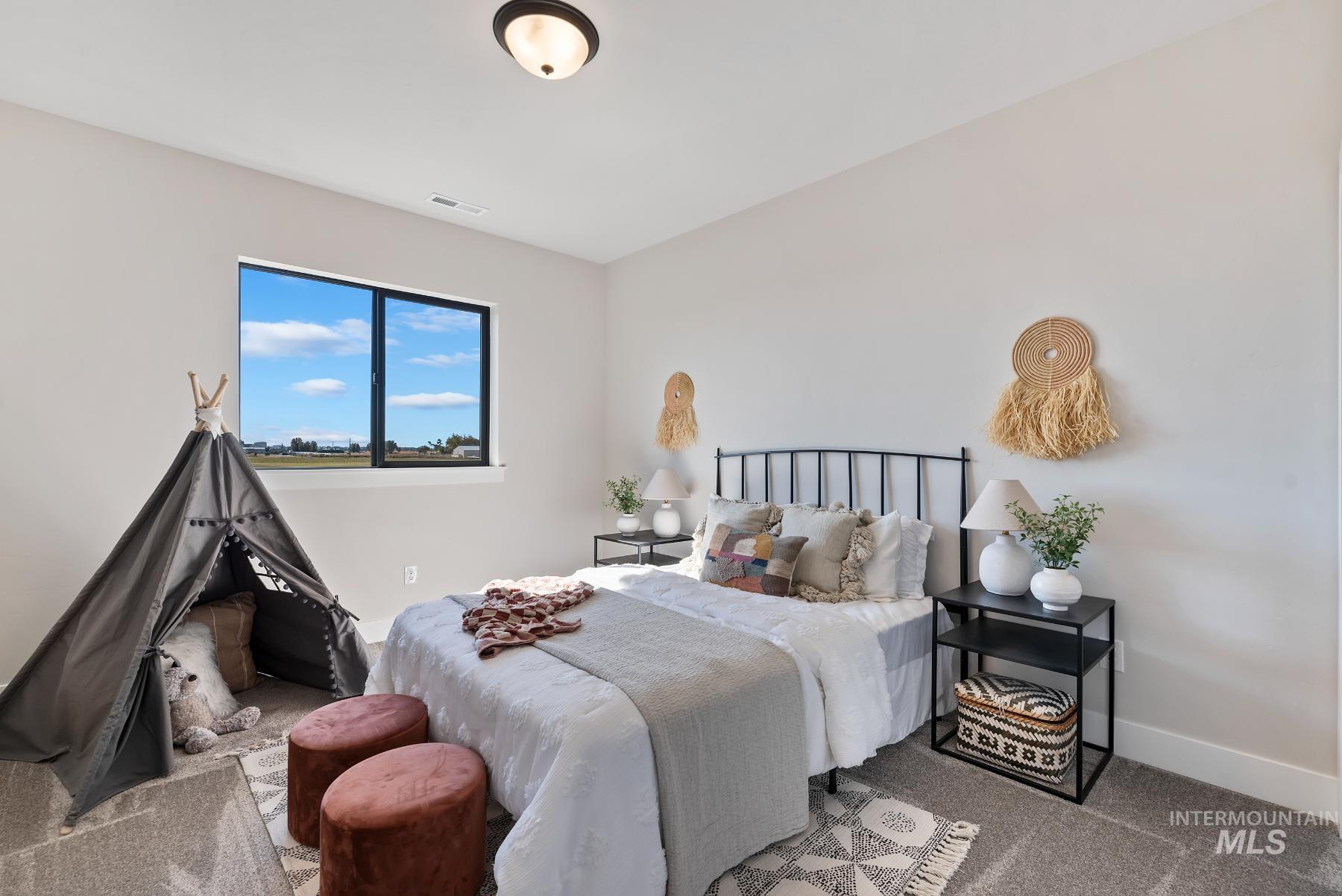 8410 West Graye Street, Unit ALPINE Meridian, ID 83646 - Photo 24 of 45 Spacious room featuring light wood-finish flooring, white walls, and multiple windows