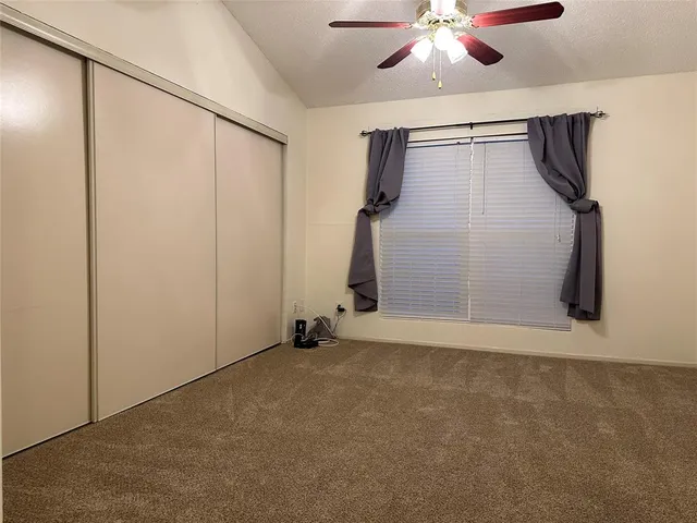 a view of an empty room with a glass door