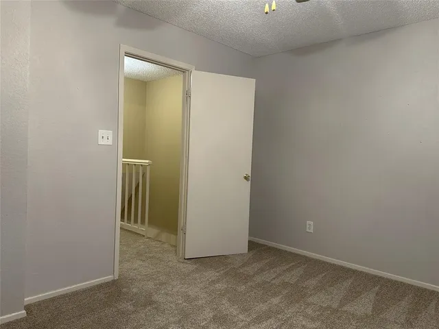 an empty room with closet area