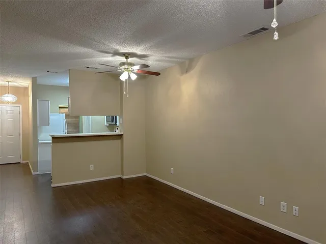 a view of kitchen with wooden floor