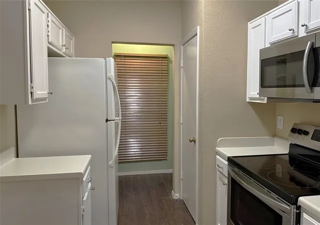 a kitchen with a stove and a microwave