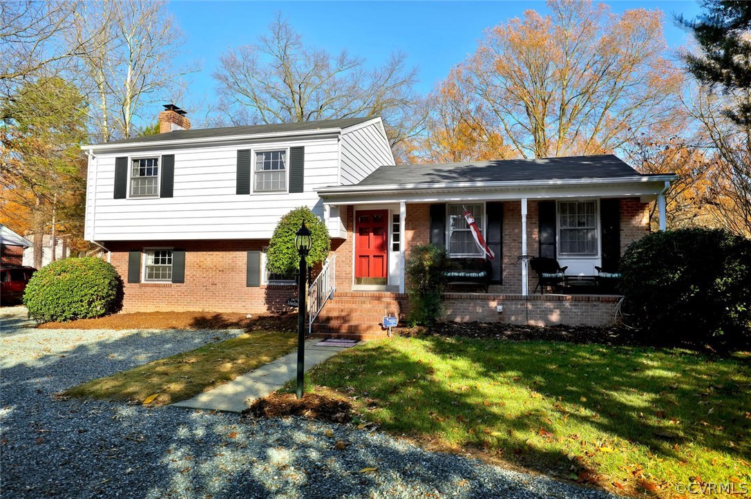 9320 Three Chopt Road Henrico, VA 23229 - Photo 1 of 32 a front view of a house with yard and green space