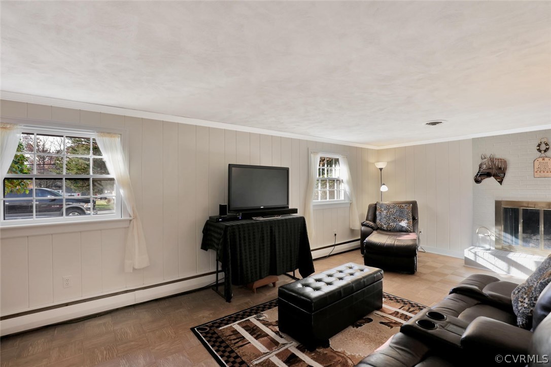 9320 Three Chopt Road Henrico, VA 23229 - Photo 14 of 32 a living room with furniture and a flat screen tv