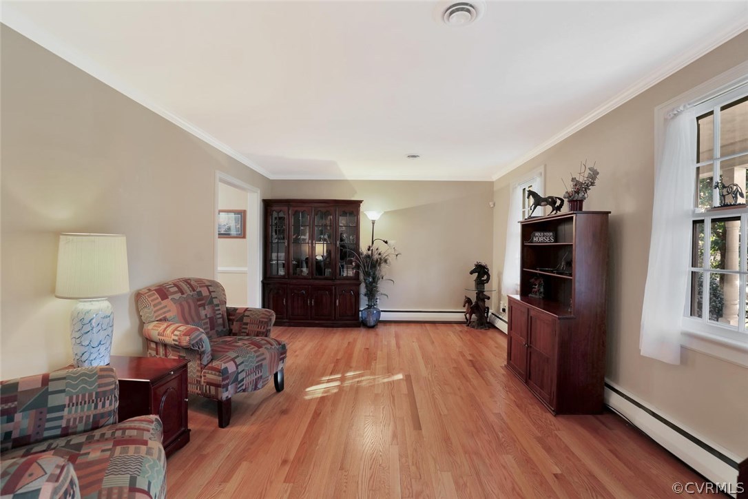 9320 Three Chopt Road Henrico, VA 23229 - Photo 4 of 32 a living room with furniture and a flat screen tv