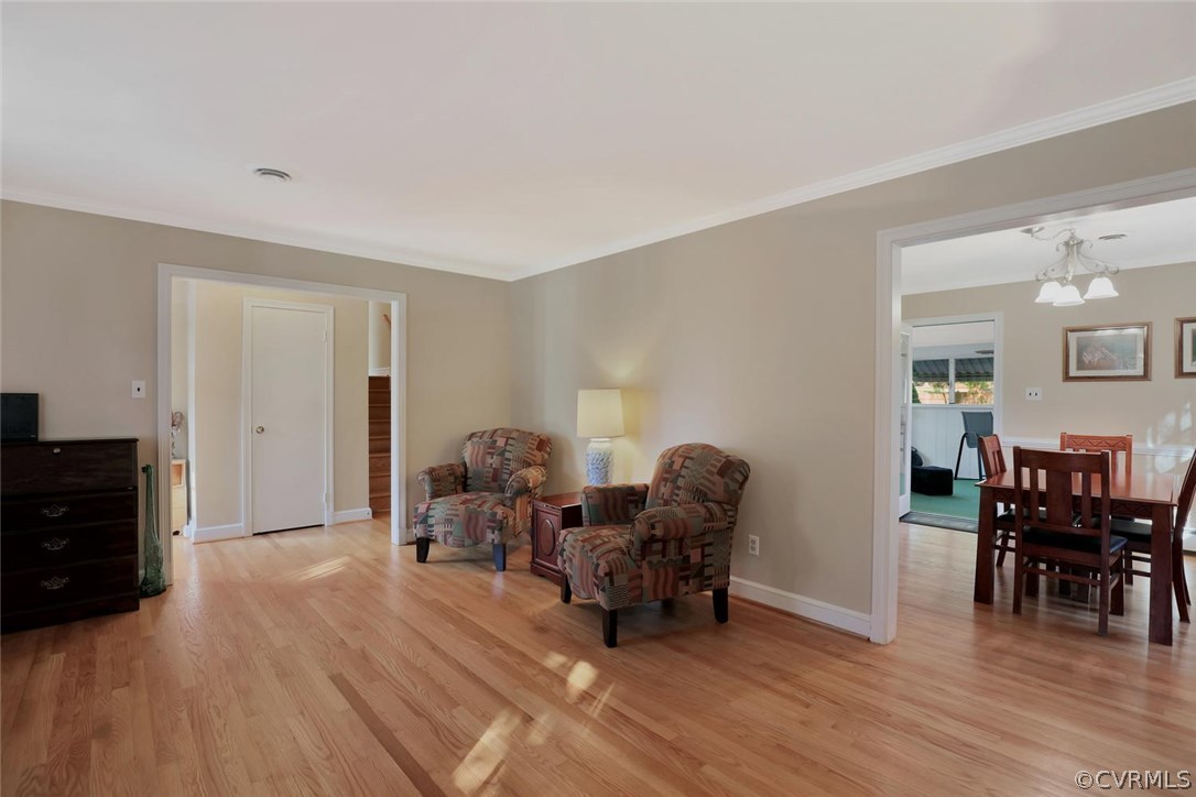 9320 Three Chopt Road Henrico, VA 23229 - Photo 6 of 32 a living room with furniture and a dining table with wooden floor