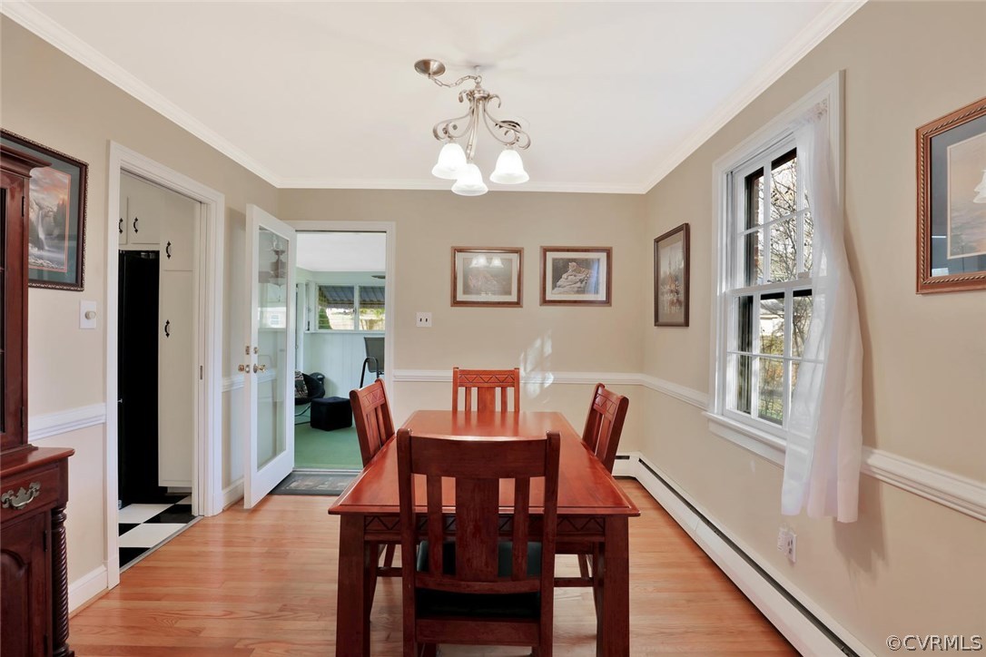 9320 Three Chopt Road Henrico, VA 23229 - Photo 7 of 32 a view of a dining room with furniture and wooden floor