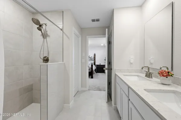 a bathroom with a sink and mirror