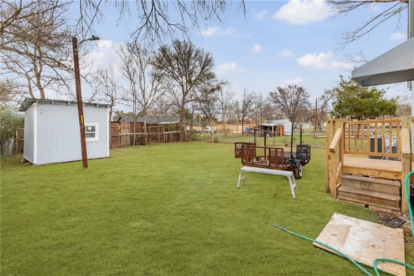 a view of a house with a yard porch and sitting area