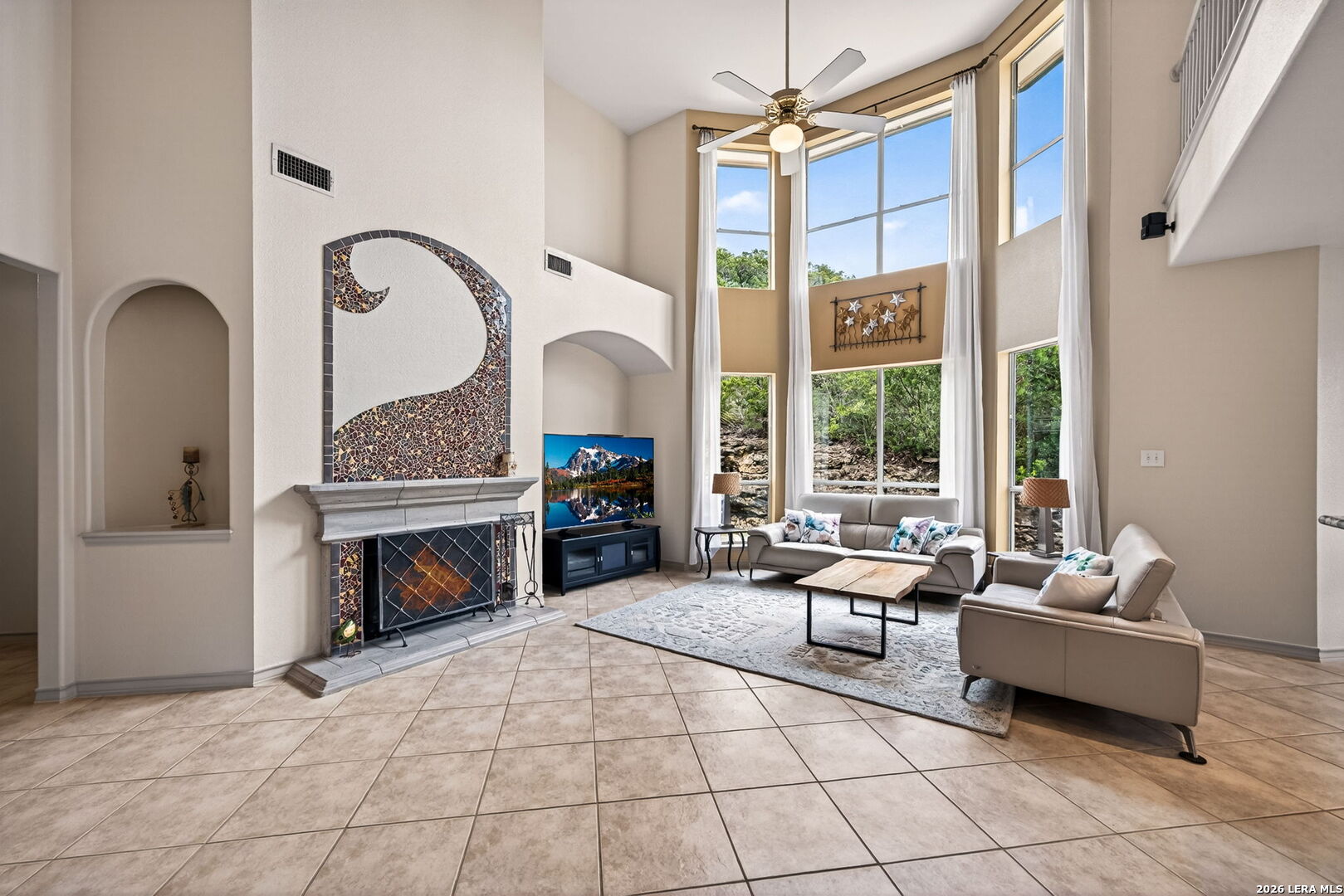 17431 Helotes Spring Road Helotes, TX 78023 - Photo 12 of 50 a living room with furniture and a fireplace