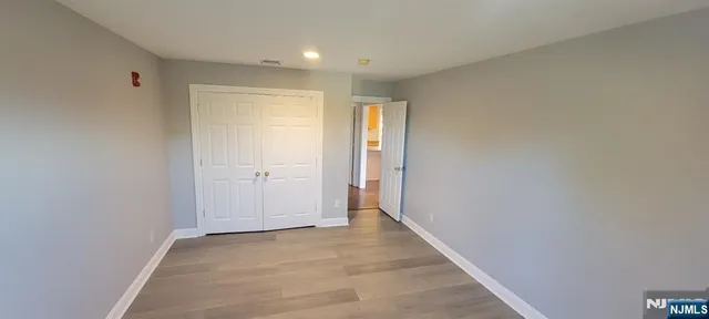 a view of a garden with a large tree