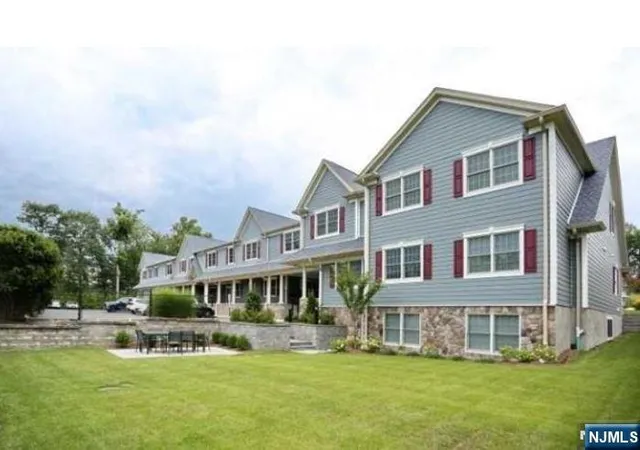 a front view of building with yard