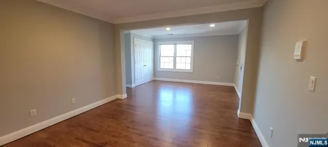 a kitchen with kitchen island a sink appliances and a counter top space
