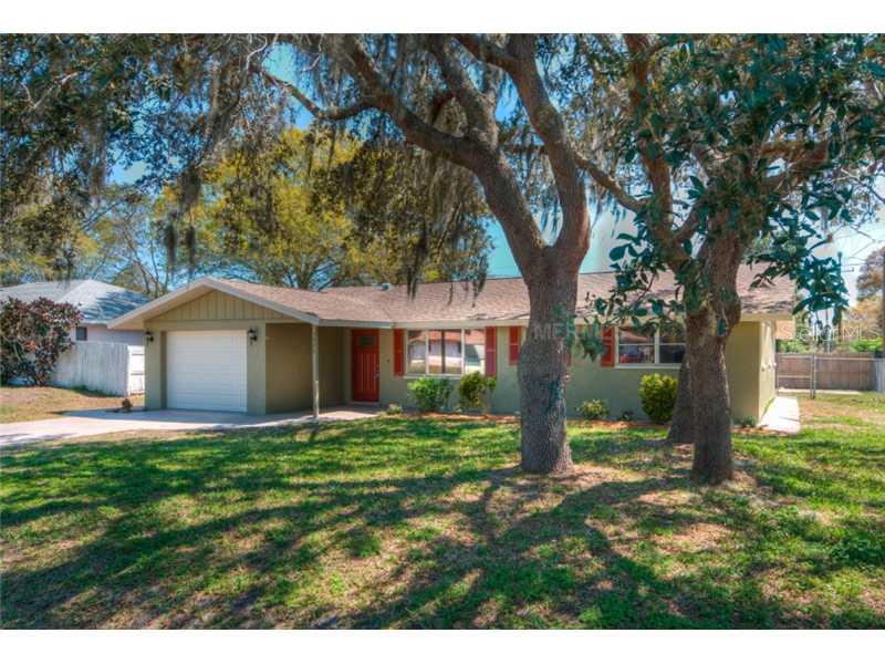1227 Horizon Road Venice, FL 34293 - Photo 1 of 1 a front view of a house with a yard and trees