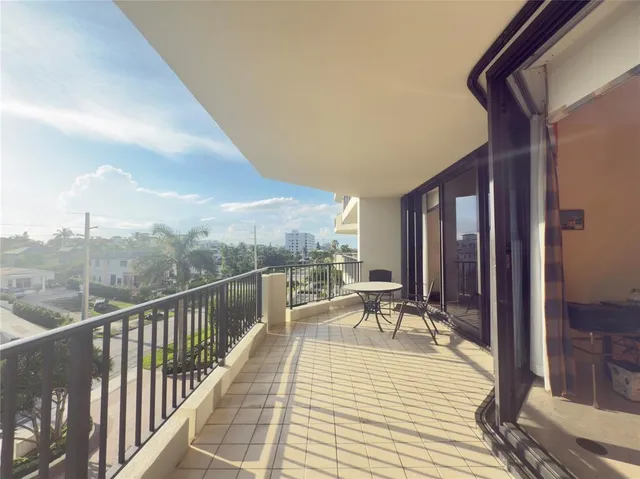 a view of balcony with couch and wooden floor
