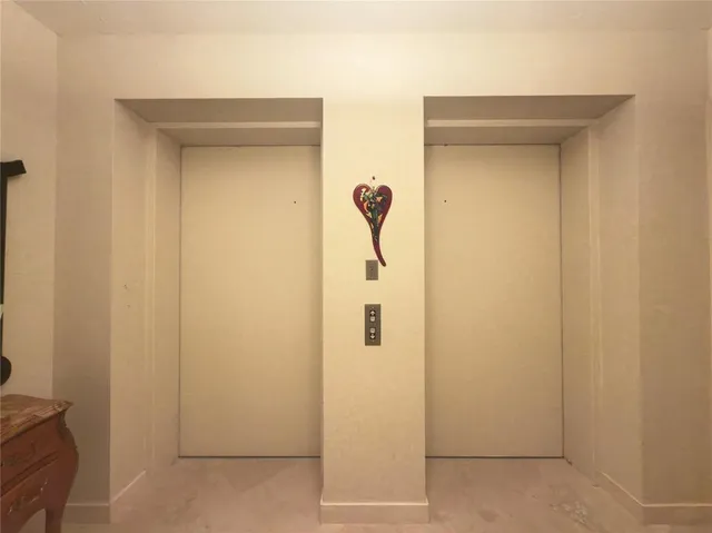 a bathroom with a shower and a door