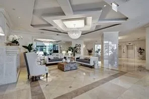 a living room with lots of furniture and white walls