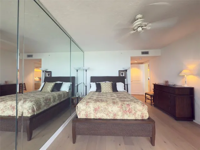 a bedroom with a bed and dresser