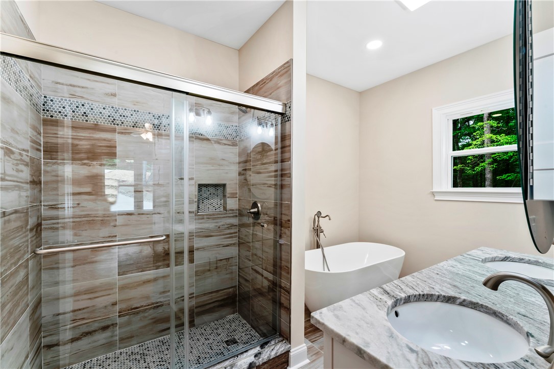 110 Gabriel Way Pickens, SC 29671 - Photo 22 of 48 A rejuvenating oasis with a sleek walk-in shower and a freestanding soaking tub.