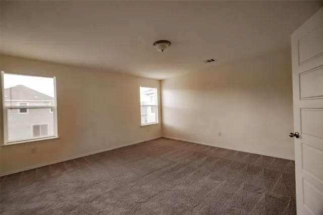 a view of an empty room and closet