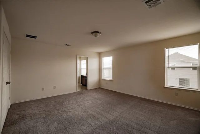 a bathroom with a double vanity sink and mirror