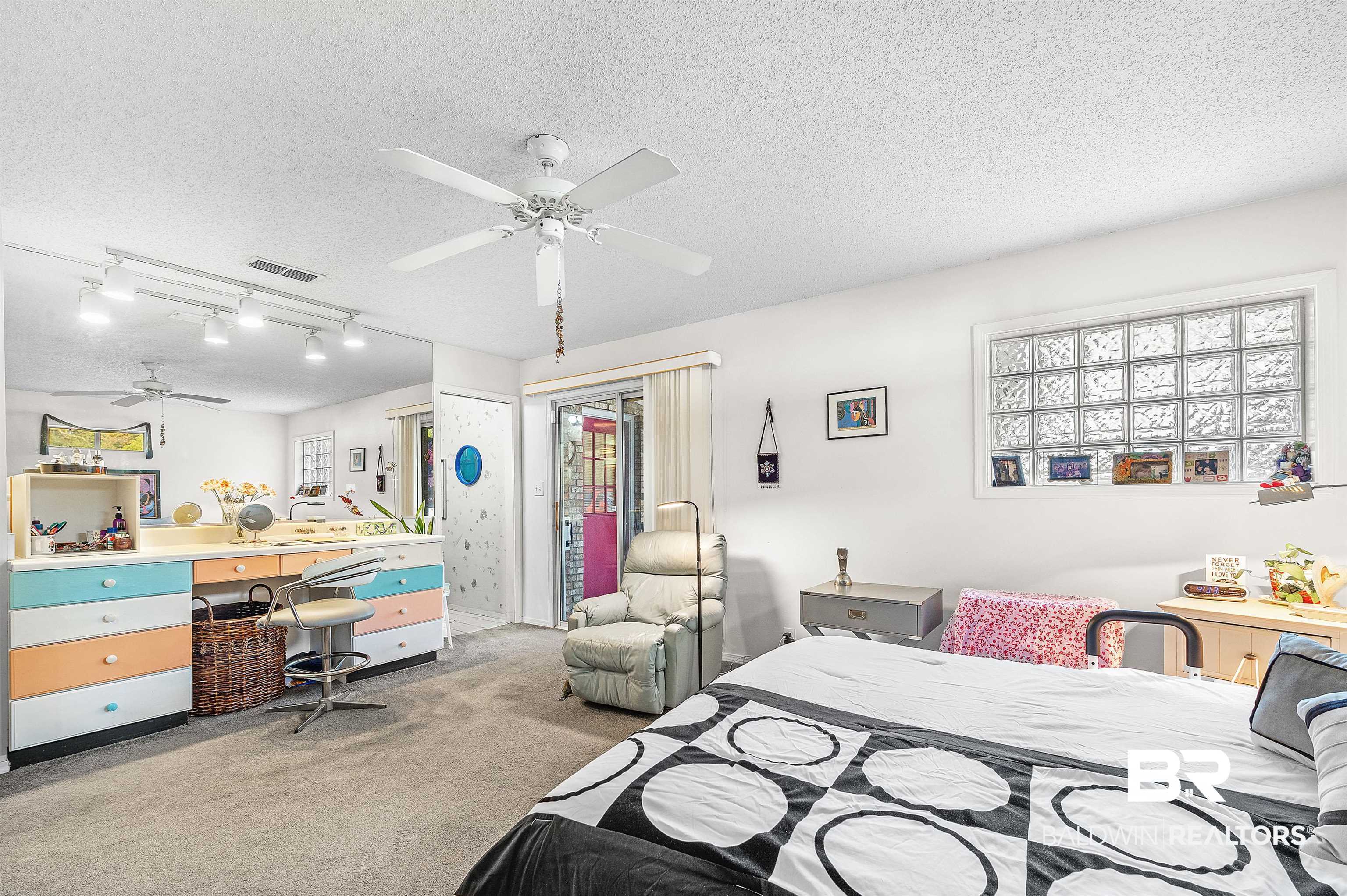 526 Ariel Avenue Foley, AL 36535 - Photo 27 of 33 Bedroom featuring light carpet, ceiling fan, and a textured ceiling