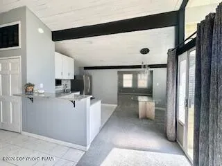 a bedroom with a bed and a large mirror
