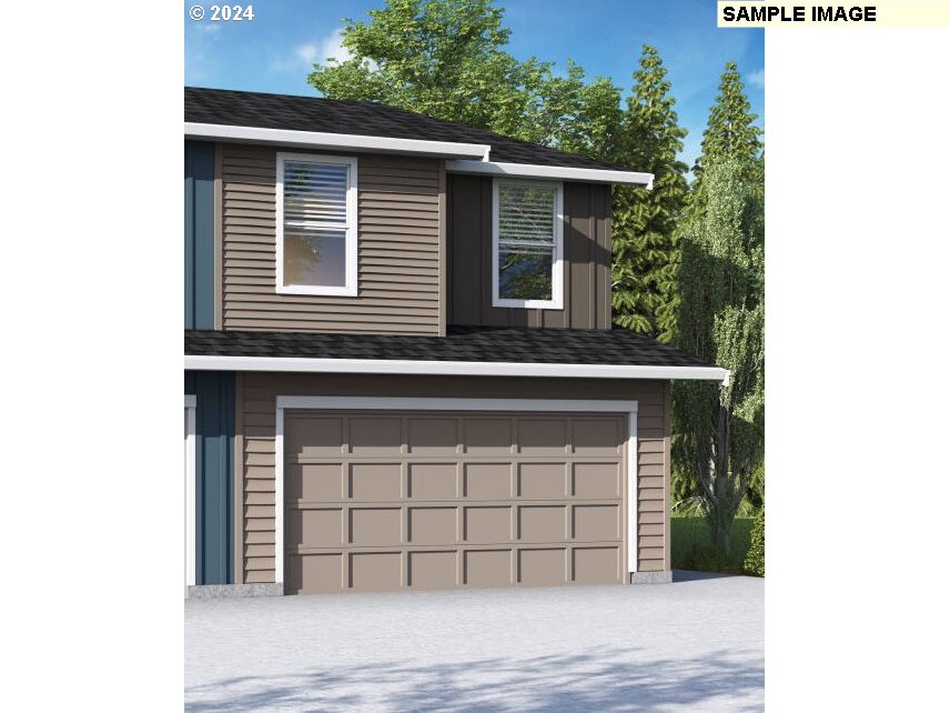 17524 Northwest 10th Place Ridgefield, WA 98642 - Photo 1 of 2 a view of a house with a window and garage