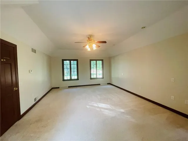a en suite bathroom with a tub sink and mirror