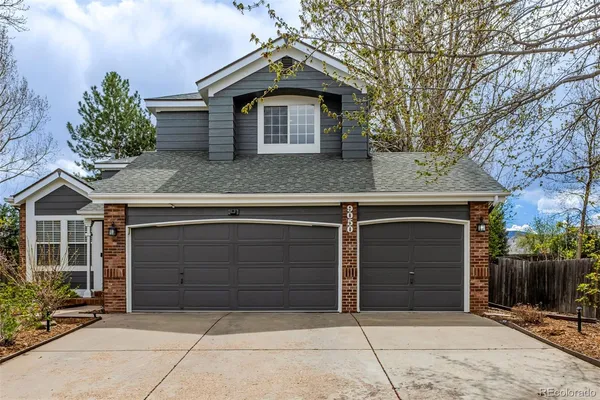 a front view of a house with a garage