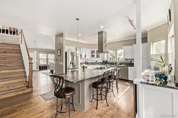 a view of a kitchen and dining room